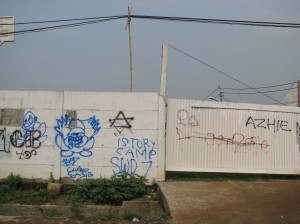 Graffitti on a wall in Jakarta.  The six-pointed star was commonly found on Jakarta's walls.  I asked what it meant and someone told me it was the insignia of a street gang while someone else told me it was a cigarette brand.